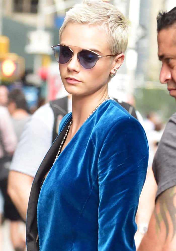 Cara looked chic in blue-tinted "So Real" sunglasses from Christian Dior