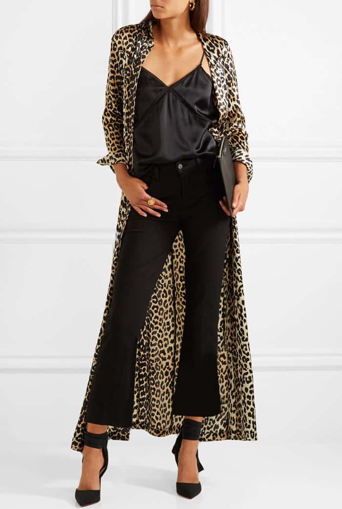 Model wearing black 'Douce du Desert' pumps with a 'Dufort' leopard-print silk-blend satin maxi dress from Ganni, a 'Bailey' chiffon-trimmed silk-charmeuse camisole from Cami NYC, and L'Agence's 'Serena' jeans that are made from soft black denim