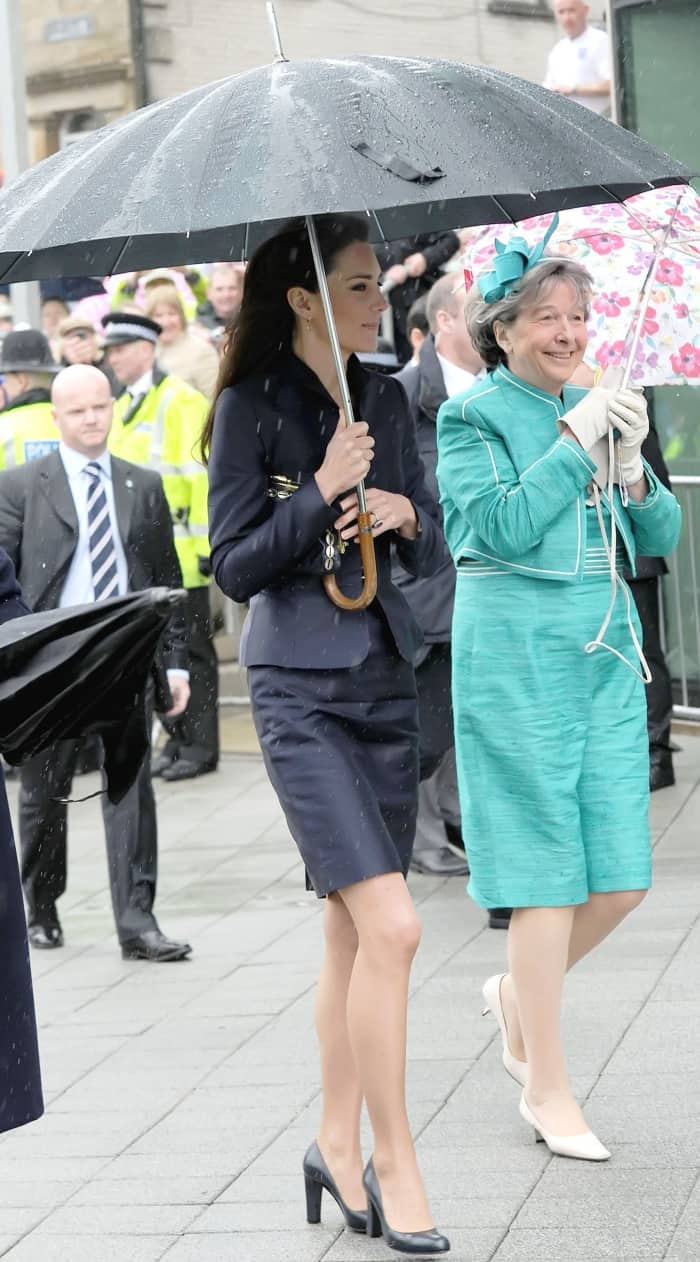 Kate Middleton wearing a navy suit jacket with a matching navy skirt and L.K. Bennett "Art" pumps