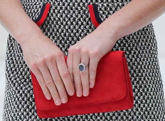 Kate Middleton carrying a red Emmy London clutch