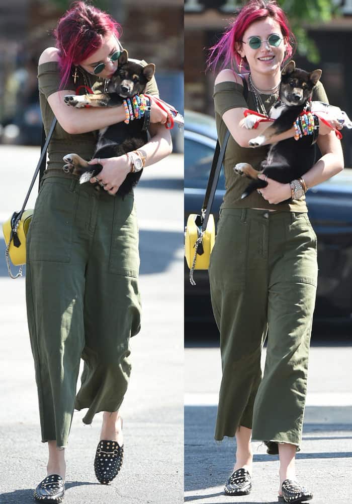 Bella stepped out in a navy green top from Rainbow