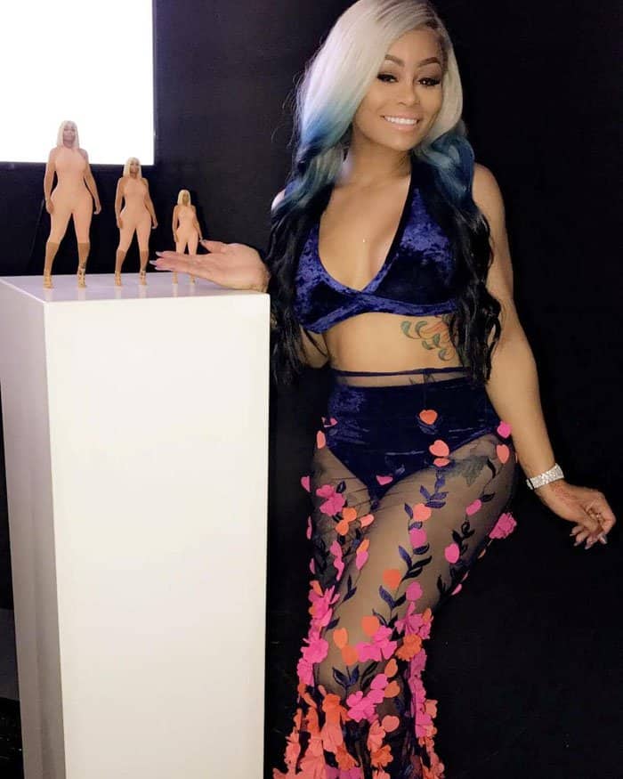 Chyna poses beside her "Rosebud" dolls