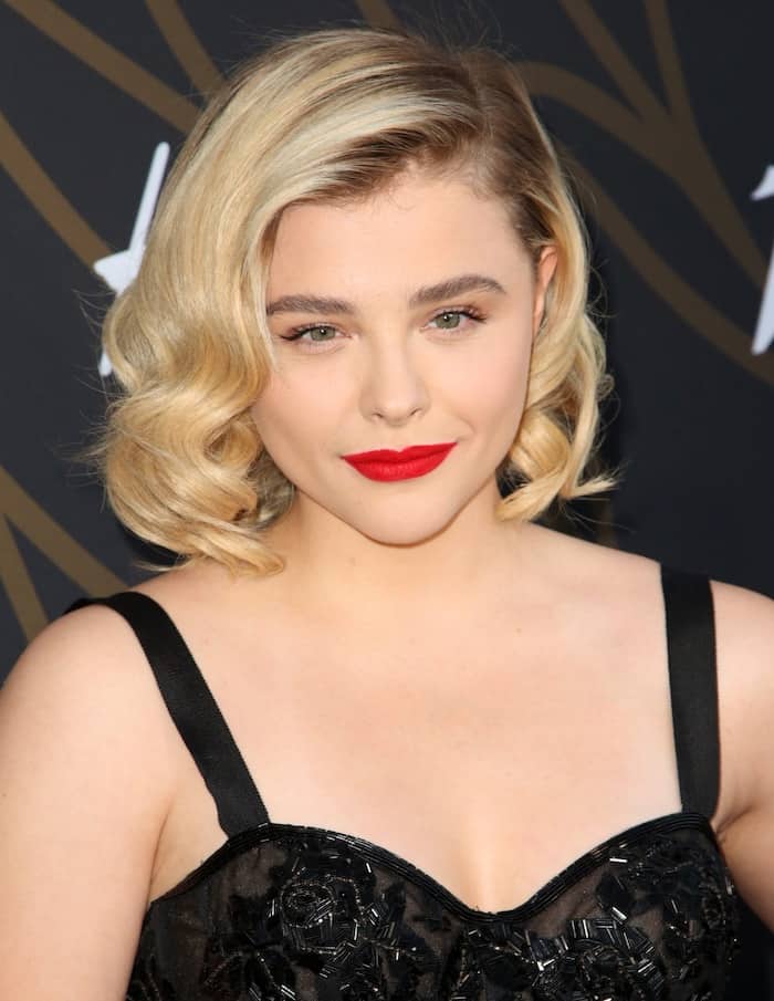 Chloe Moretz complemented her '50s glam look with a wavy bob and bright red lips