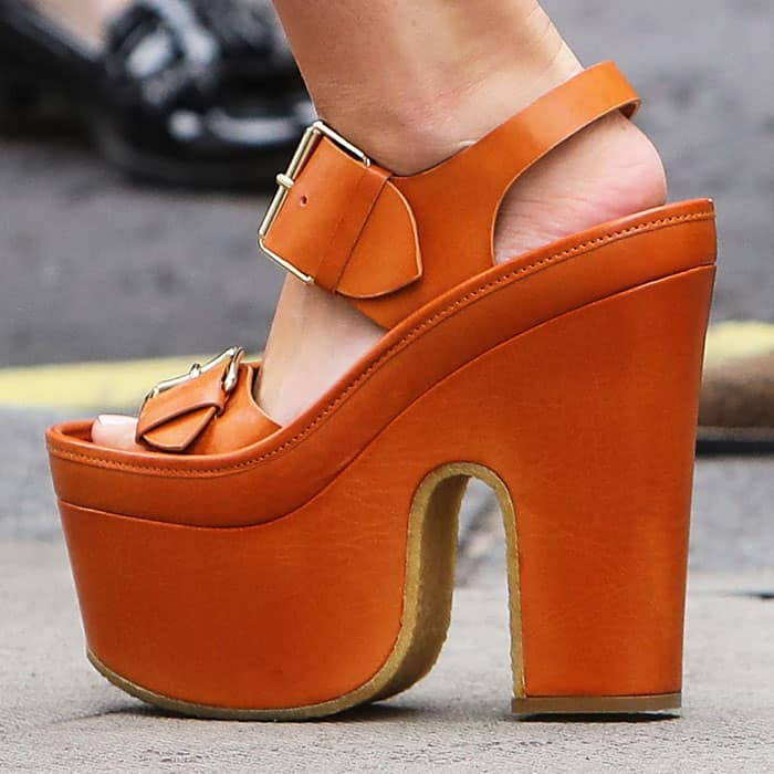 Mollie makes an unlikely pairing with the towering Stella McCartney platform sandals