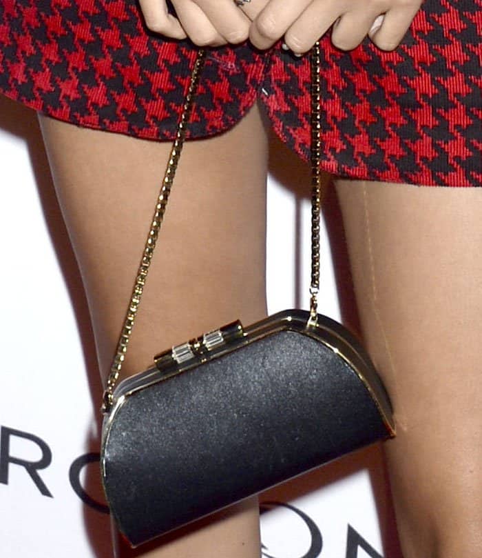 The actress accessorized with a tiny black purse