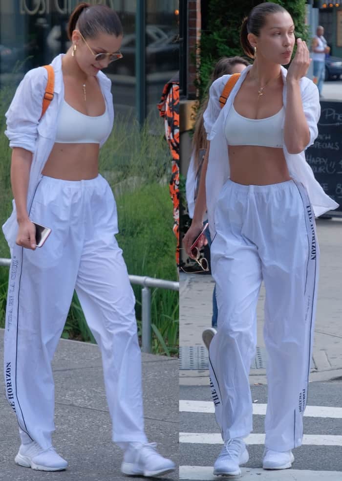 Bella Hadid wearing a Splits59 sports bra, Hyein Seo track pants, and Nike "Air Presto Flyknit Ultra" sneakers while out and about in New York City