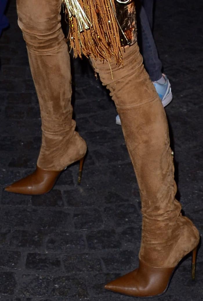 Karolina Kurkova wearing brown suede legging boots at the Vogue Paris Foundation dinner