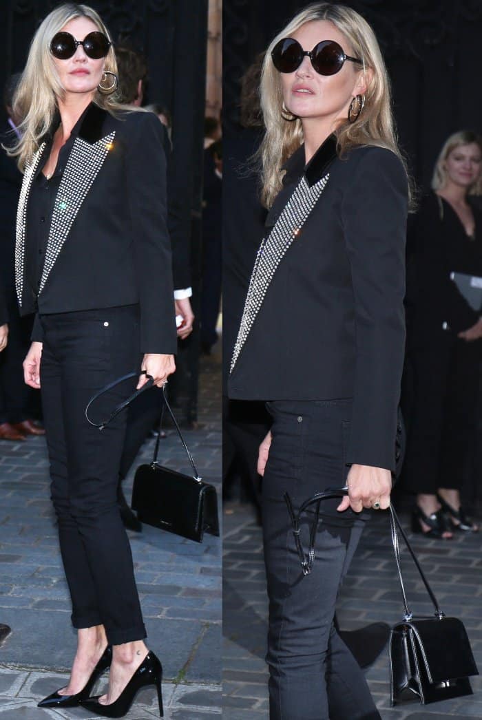 Kate Moss wearing a Saint Laurent by Anthony Vaccarello blazer, black top, black denim pants, and black pointy-toe pumps at the Vogue Paris Foundation dinner