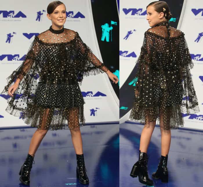 Millie Bobby Brown wearing a Rodarte Spring 2017 ensemble with Stuart Weitzman "Climbing" boots at the 2017 MTV Video Music Awards