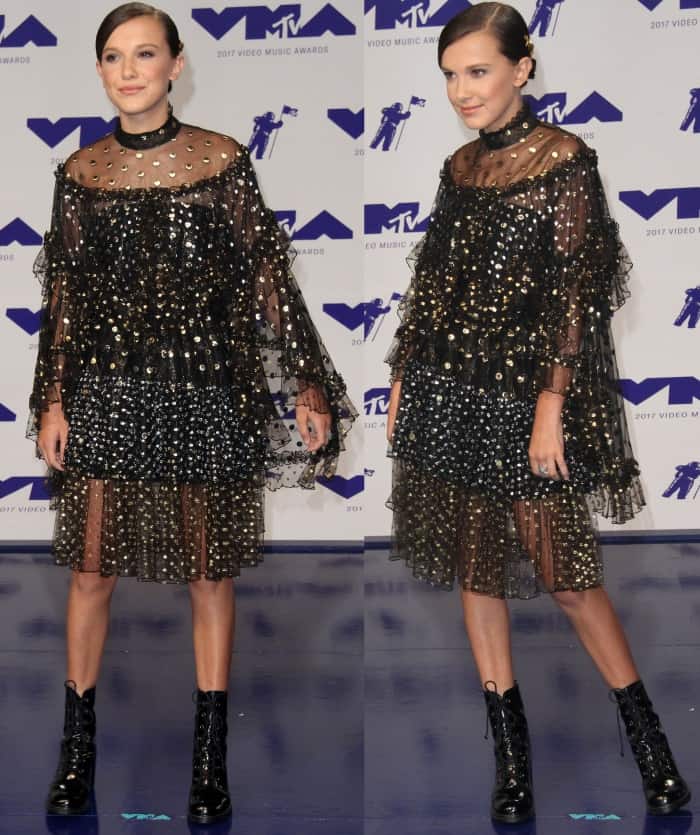 Millie Bobby Brown wearing a Rodarte Spring 2017 ensemble with Stuart Weitzman "Climbing" boots at the 2017 MTV Video Music Awards