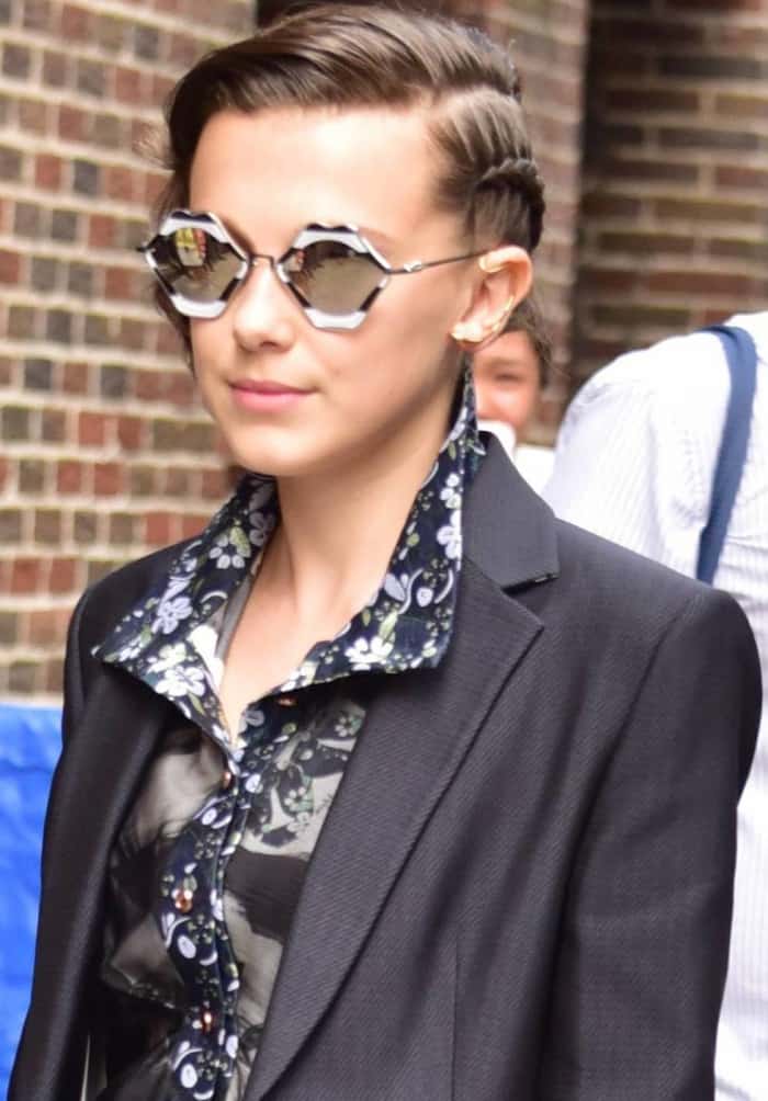 Millie Bobby Brown wearing a CG two-piece suit and Chrome Hearts sunglasses at "The Late Show with Stephen Colbert"