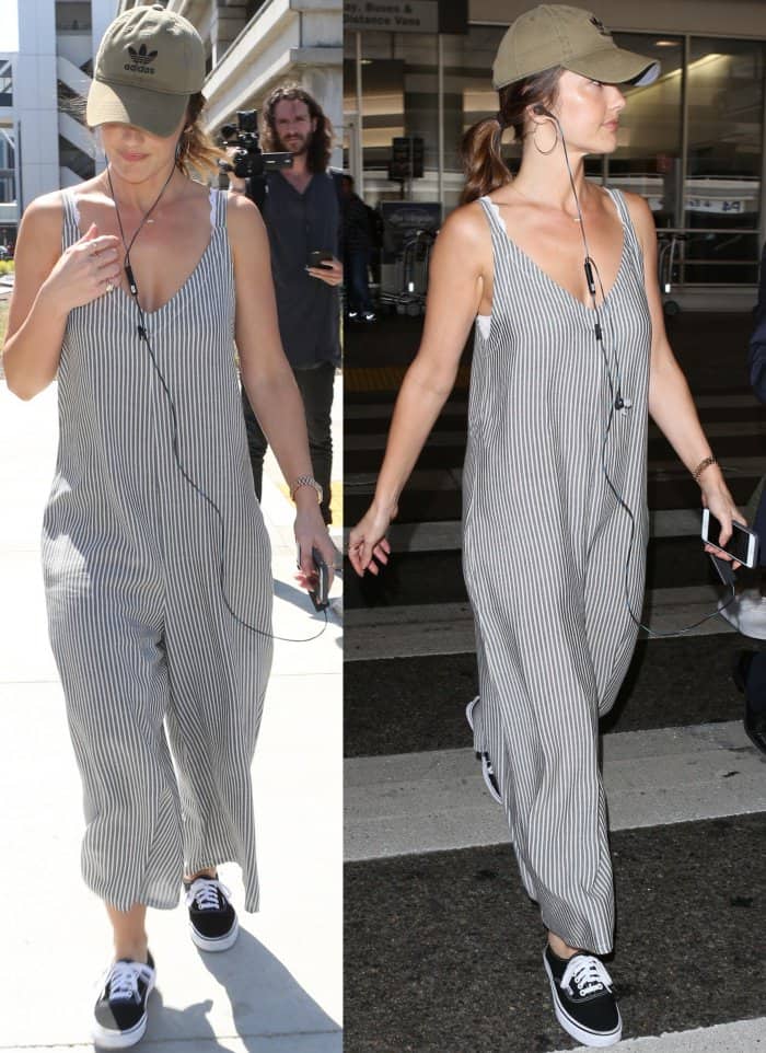 Minka Kelly arriving at LAX in an oversized striped jumpsuit and Vans "Authentic" sneakers