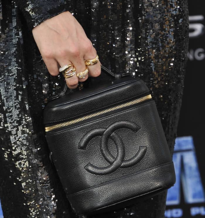 Poppy Delevingne carrying a black Chanel logo bag at the LA premiere of "Valerian and the City of a Thousand Planets"
