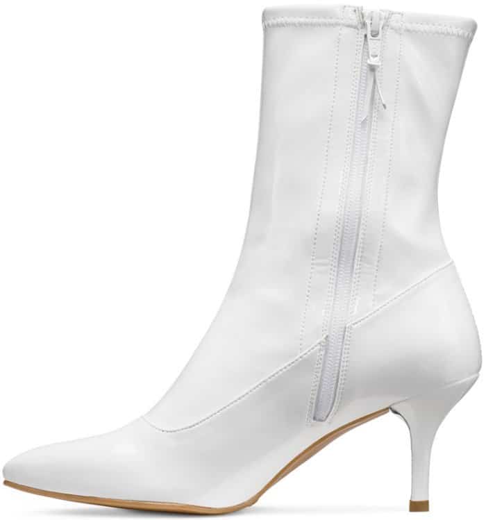 Stuart Weitzman “Clingy” booties in snow white patent leather