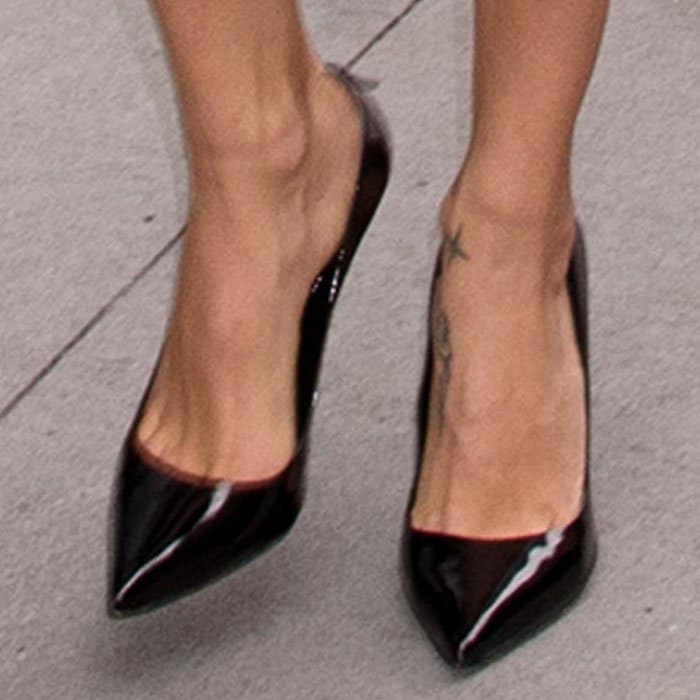 Adriana keeps things simple with a pair of Schutz "Farrah" patent pumps