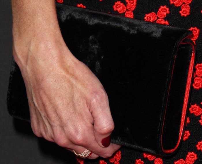Velvety goodness: Alexis complements her dress with a Christian Louboutin clutch