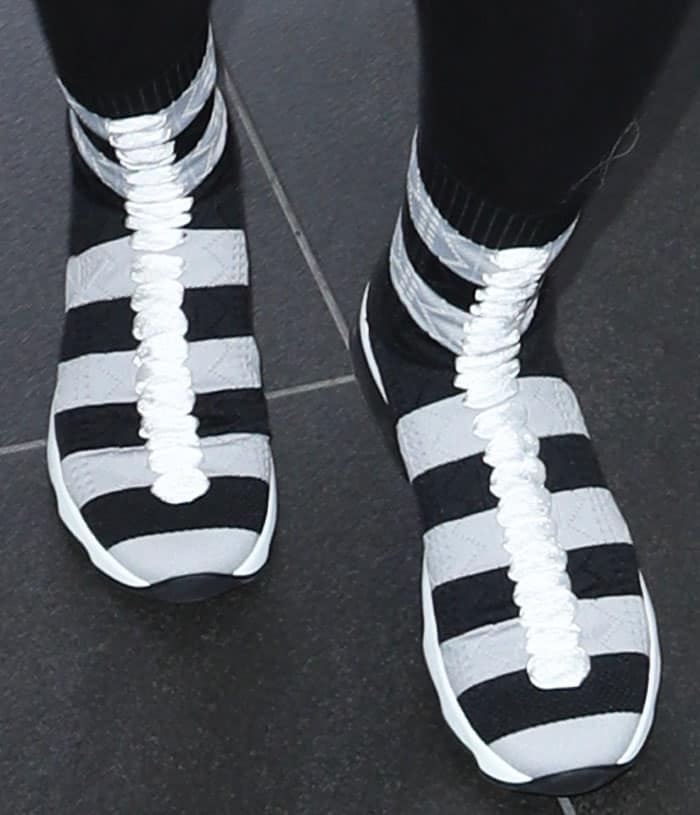 Chyna wore a pair of the quirky Fendi sock sneakers in gray and black