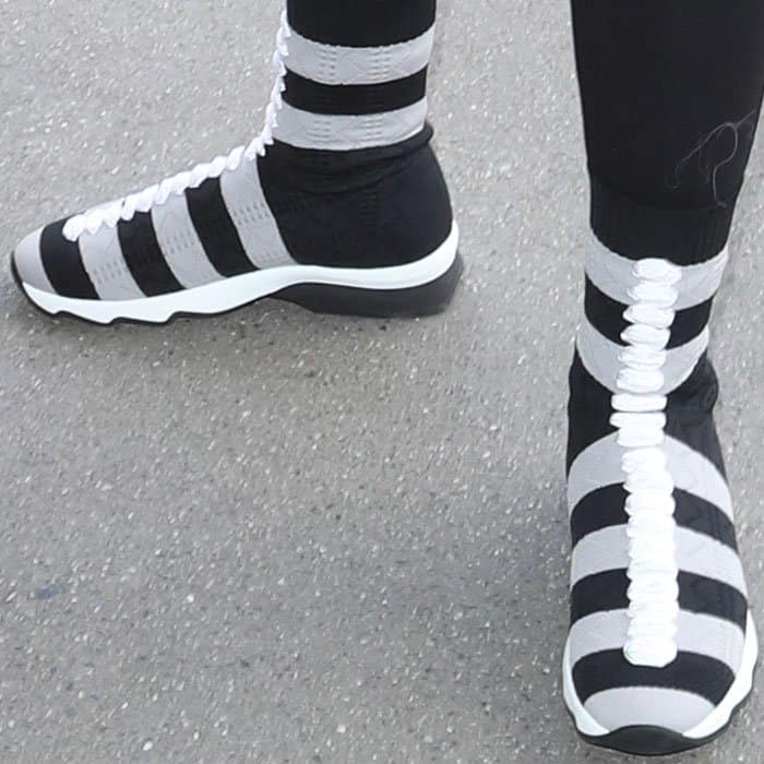 Chyna wore a pair of the quirky Fendi sock sneakers in gray and black