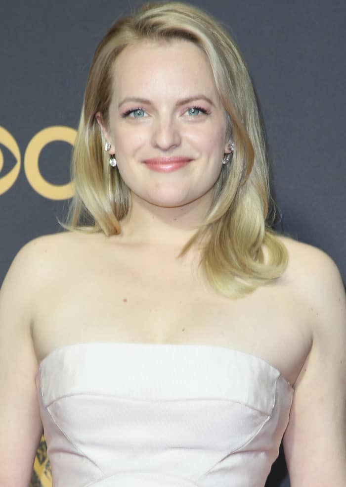 Elisabeth Moss young and vibrant in a blush pink Atelier Prabal Gurung midi that included a tulle skirt underlay