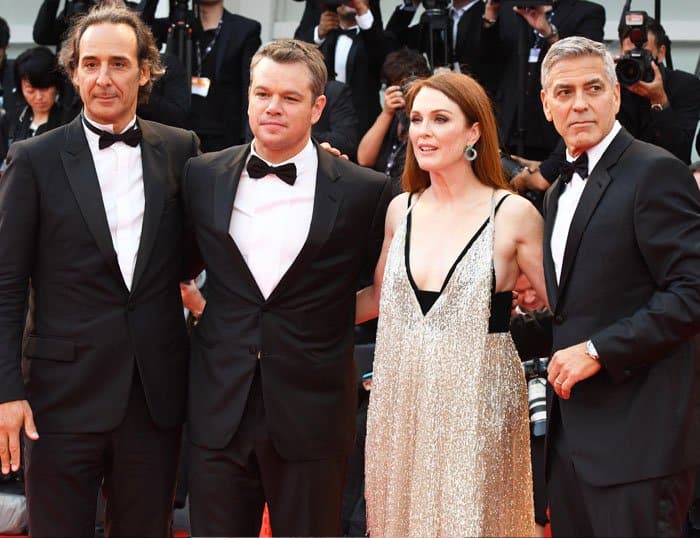 The leading lady poses with her leading men in the film "Suburbicon"