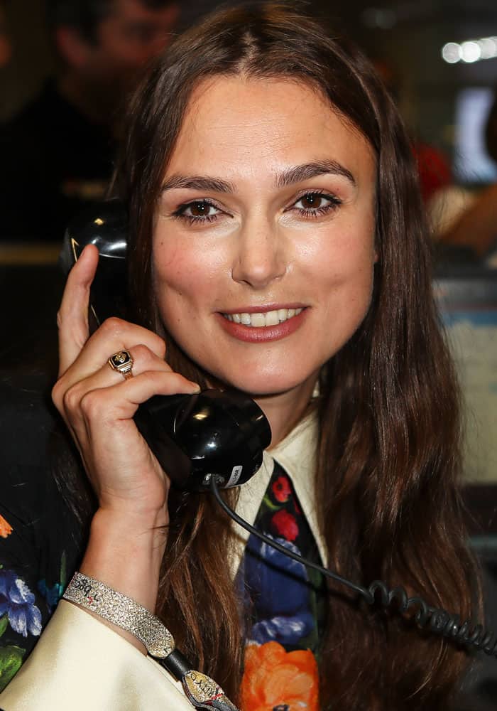 Keira flashes a smile as she takes a phone call from a willing donor