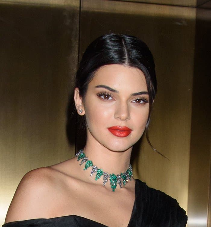 Kendall Jenner in a Giambattista Valli couture gown and Jimmy Choo "tizzy" ankle wrap sandals.