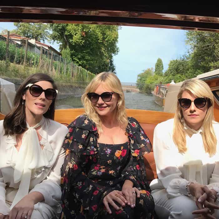 The actress takes a boat photo with "Woodshock" directors Laura and Kate Mulleavy