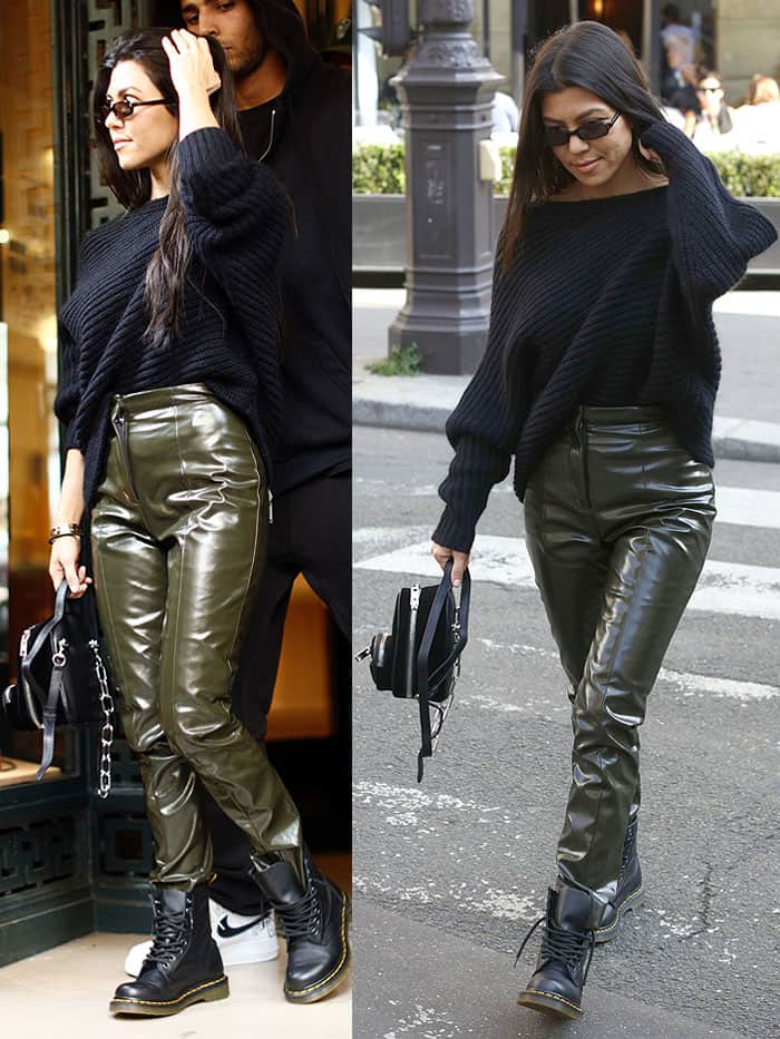 Kourtney Kardashian wearing glossy pants and Dr. Martens boots in Paris, France, on September 26, 2017.
