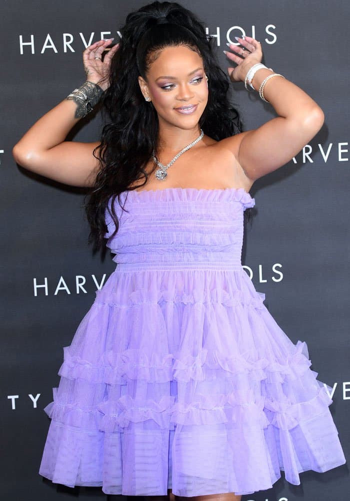 Rihanna flashed the cameras a smile at the launch of her beauty line