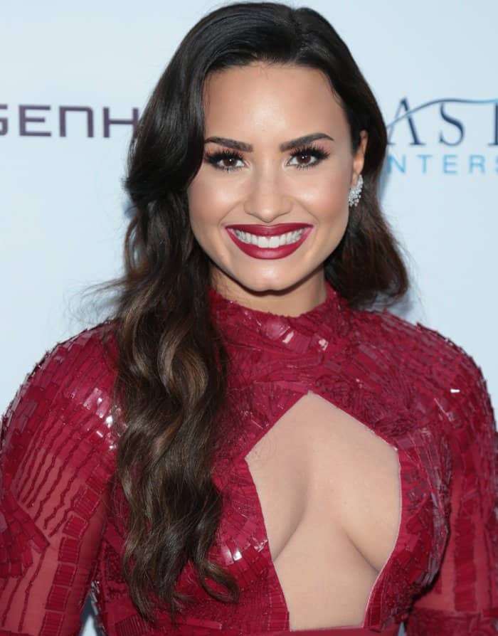 Demi Lovato wearing a red Bibhu Mohapatra Fall 2017 dress at the Brent Shapiro Foundation for Alcohol and Drug Prevention 2017 Summer Spectacular