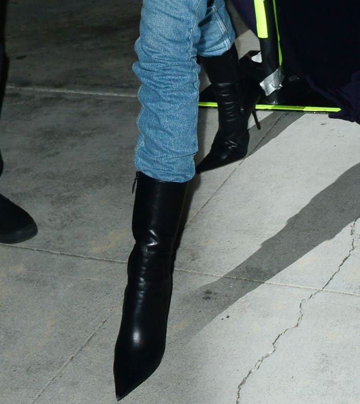 Kendall Jenner wearing Balenciaga black leather pointy-toe ankle boots while leaving a church service in Beverly Hills