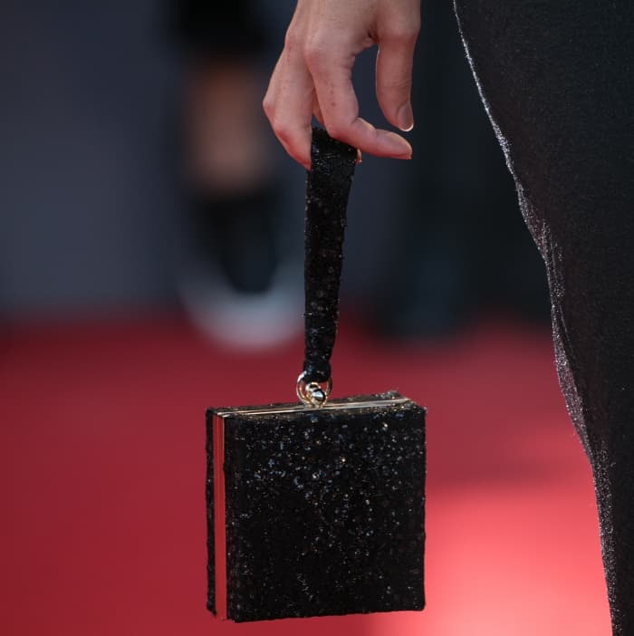 Rebecca Hall carrying a black embellished box clutch at the "Mother!" premiere during the 74th Venice Film Festival