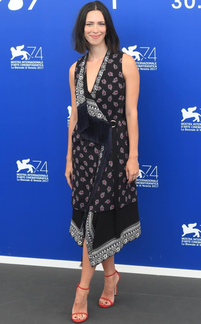 Rebecca Hall wearing an Altuzarra Resort 2018 dress and red ankle-strap sandals at the 74th Venice Film Festival jury photocall