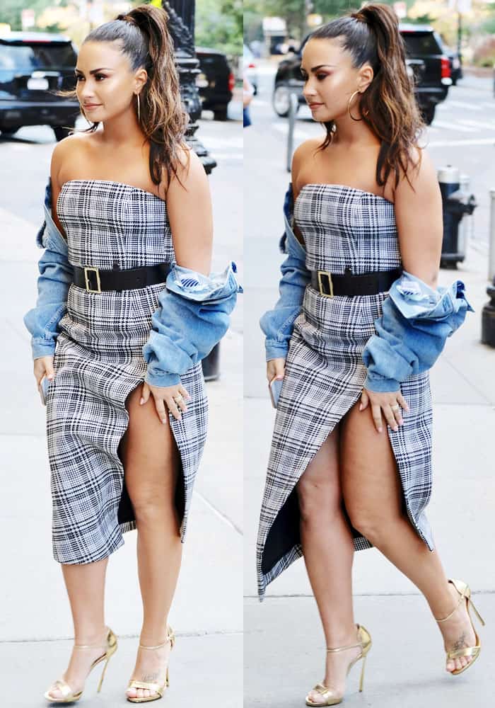 Demi turned heads in an Off-White plaid dress and cropped denim jacket