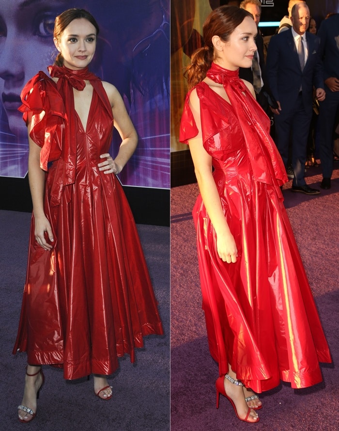Olivia Cooke's Calvin Klein 205W39NYC lightweight nylon dress is sleeveless at left and features a short drop-shoulder right sleeve