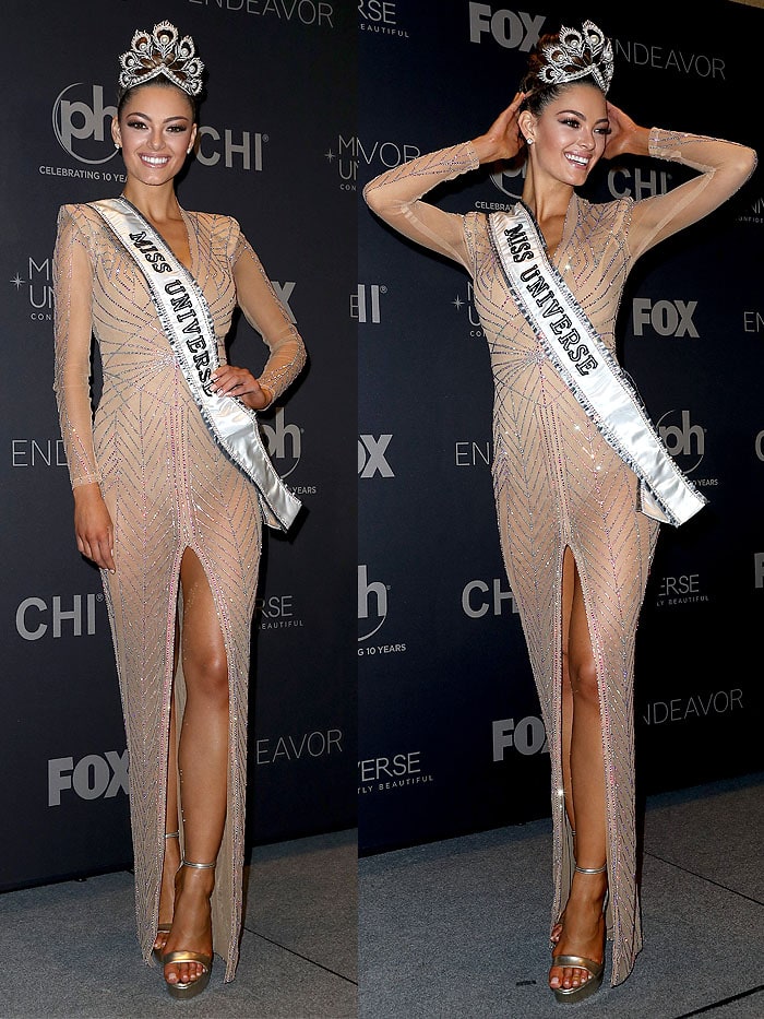 For her winning moment, Demi-Leigh was outfitted in a sheer, nude, long-sleeved evening gown custom-made for her by South African fashion designer Anel Botha