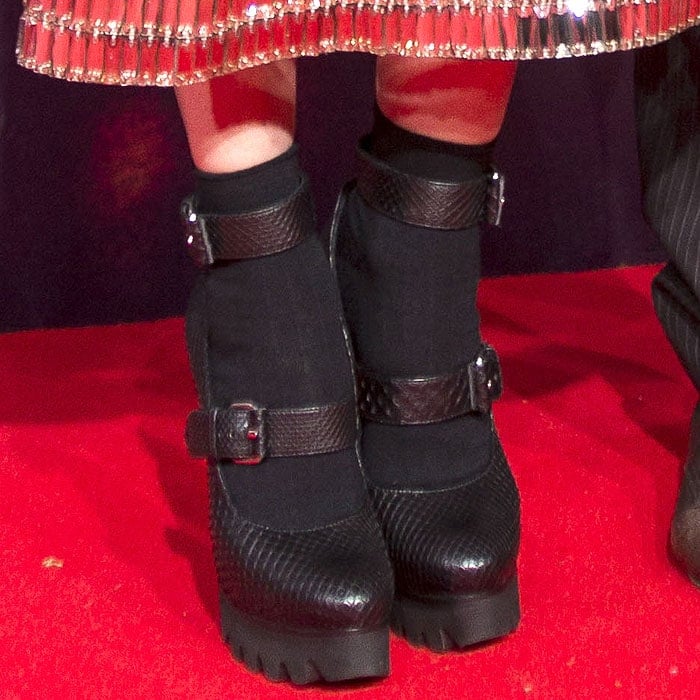 Closeup of Diane Kruger's double-buckled, snake-embossed, lug-sole platform pumps.