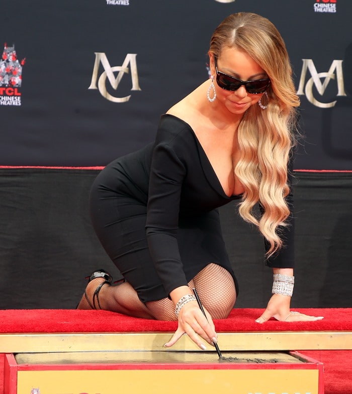 Mariah Carey donned a plunging black dress for her hand and footprint ceremony at the iconic Hand and Footprint Ceremony at TCL Chinese Theatre in Hollywood, California, on November 1, 2017