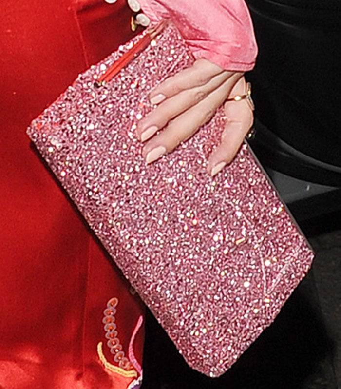 Rosie ushered in the holidays with a glitter clutch by Jimmy Choo
