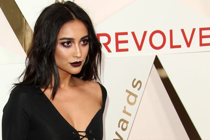 Shay goes for dark makeup to match her all-black outfit