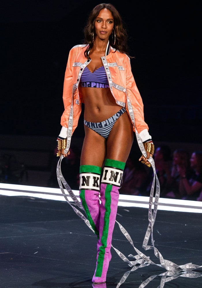 Leila Nda walks the runway in a crop jacket with extended straps