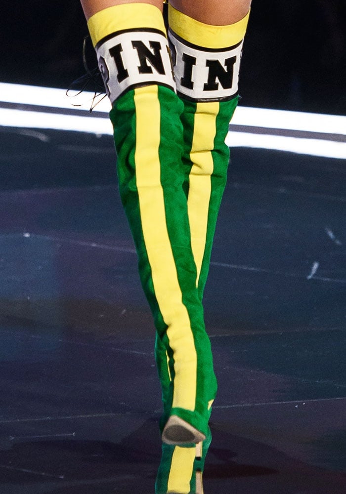 The thigh high boots also come in a green-and-yellow suede version