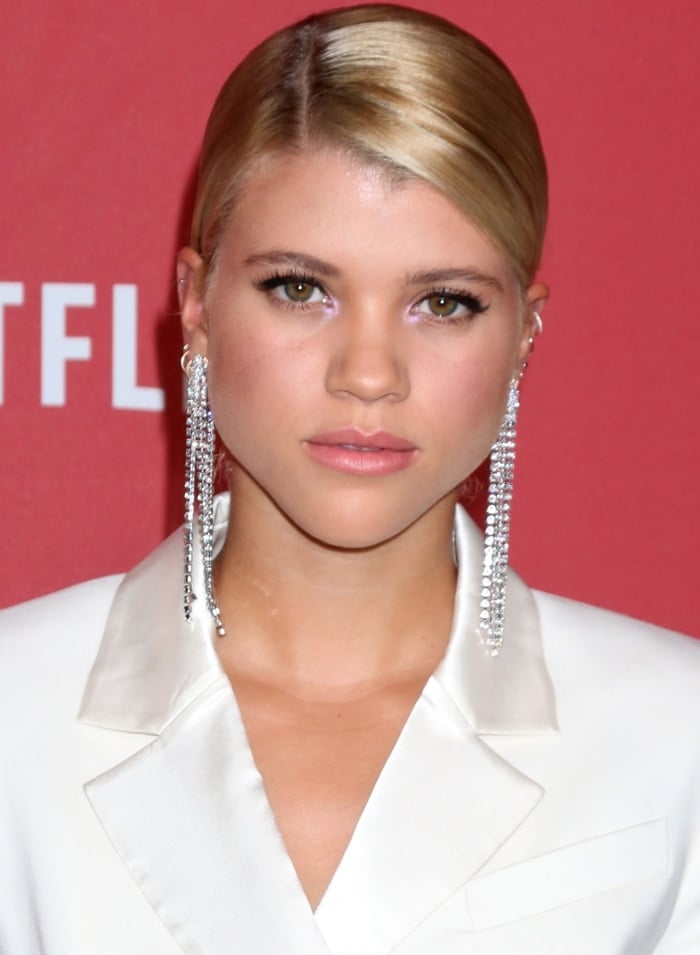 Sofia Richie wearing a Rachel Zoe ivory tuxedo dress and statement earrings at the SAG-AFTRA Foundation Patron of the Artists Awards