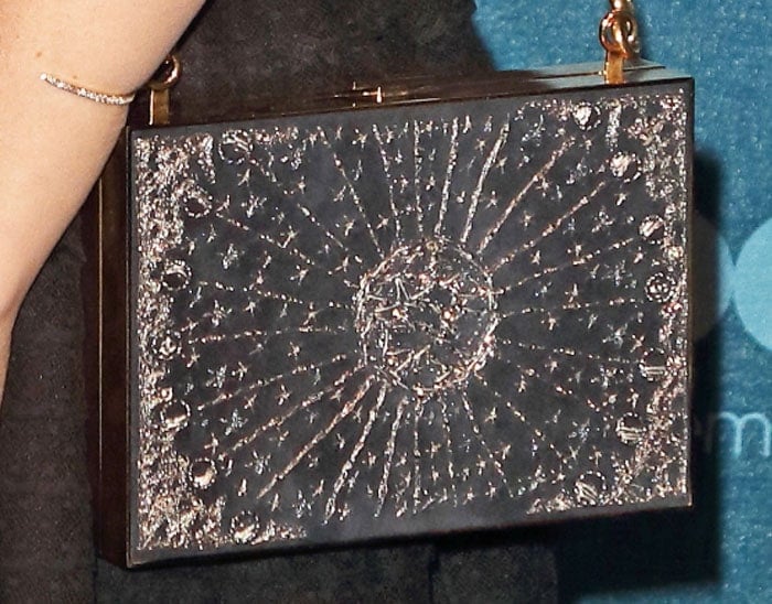 Kate's metallic clutch more than makes up for her lack of accessories