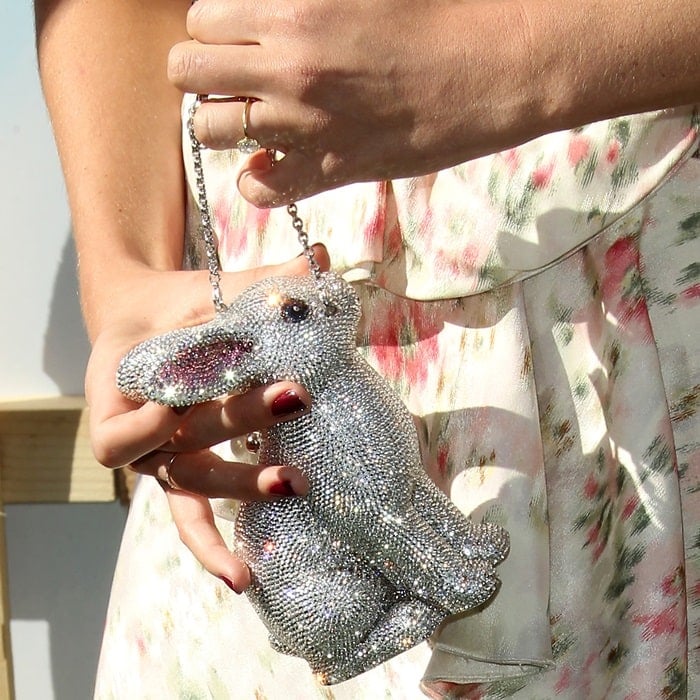 Margot Robbie toting a Judith Leiber Couture hard-shell minaudiere clutch bag in bunny shape