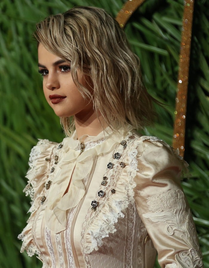 Selena Gomez wearing a Coach custom midi dress at the 2017 Fashion Awards held at Royal Albert Hall in London, England, on December 4, 2017
