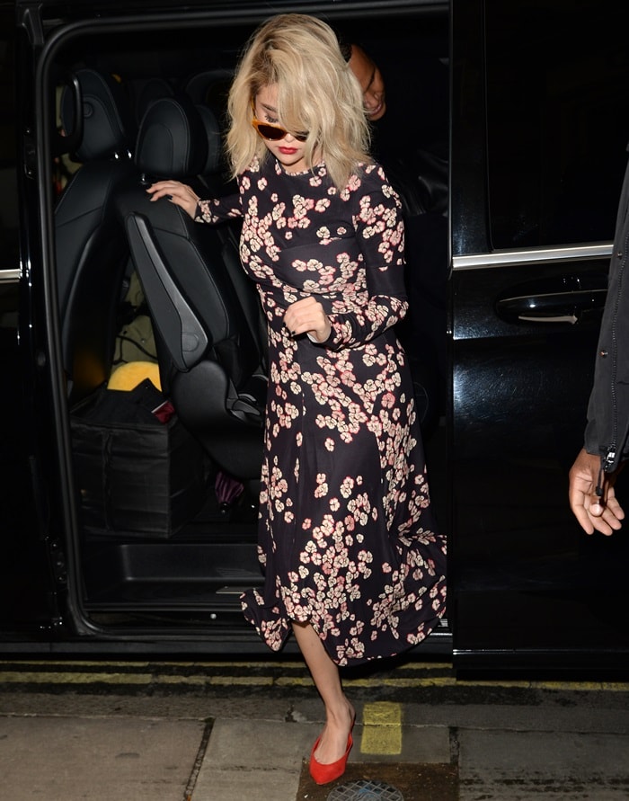 Selena Gomez wearing a floral dress from Isabel Marant while visiting the KISS FM Studios in London on December 4, 2017