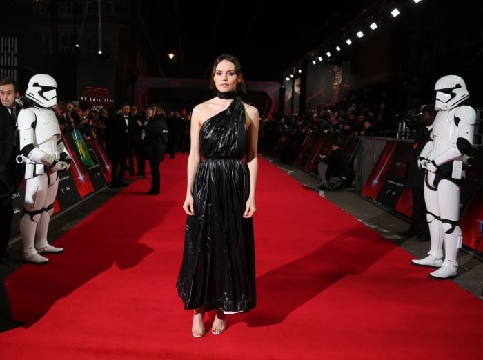 Daisy Ridley wearing a Calvin Klein 205W39NYC black nylon dress and custom Christian Louboutin "Rey" sandals at the "Star Wars: The Last Jedi" UK premiere
