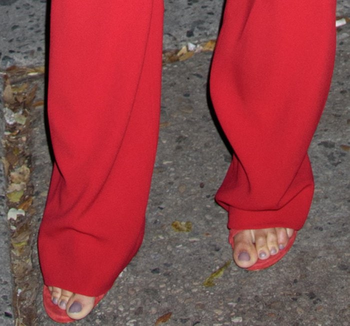 Joan Smalls wearing red Stuart Weitzman sandals while out and about in New York City