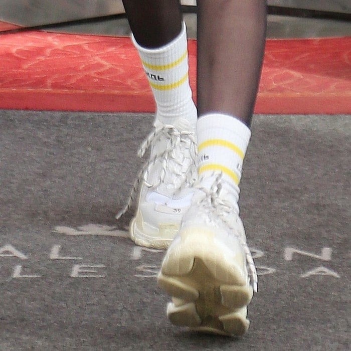Closeup of the Balenciaga men's 'Triple S' sneakers on Bella Hadid.